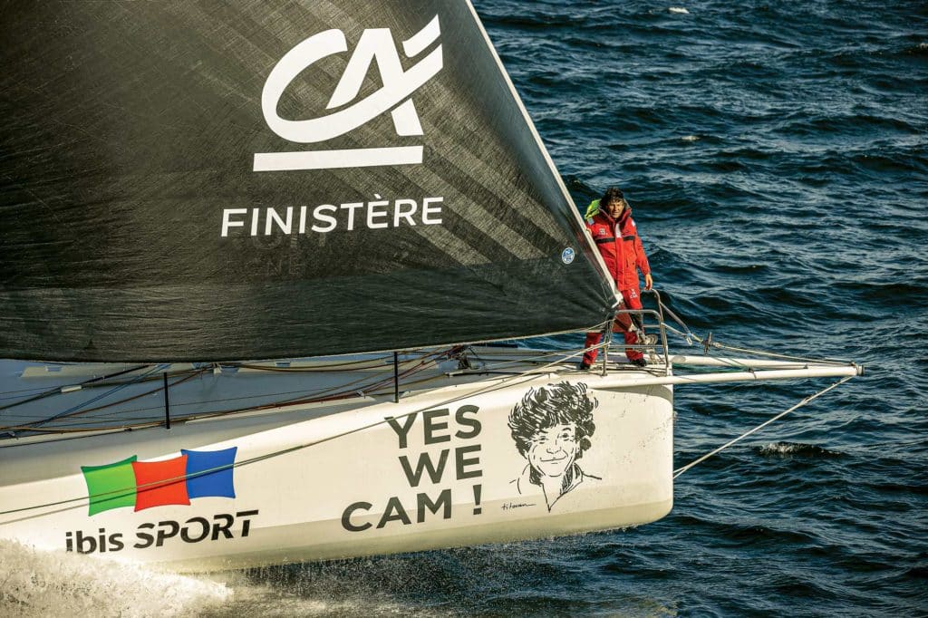 Skipper Jean Le Cam on the bow of YesWeCam