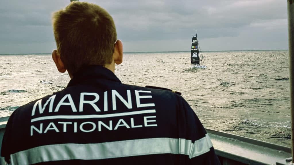 Jean Le Cam’s IMOCA 60, YesWeCam, as seen from a French navy vessel.