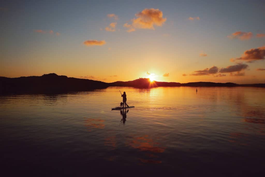 Paddleboarding in Hog Cay anchorage in the Bahamas