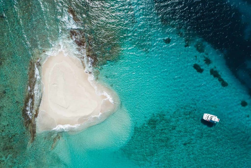 overhead view of a boat approaching a sandbar