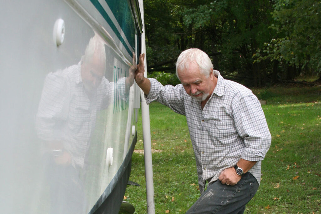 Man inspecting boat hull