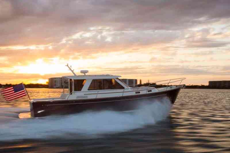 Early October on the Connecticut River near Essex seduces visiting cruisers. Once you see this lovely valley, you won’t be able to resist a return. Among the most seductive conveyances for exploring the river has to be the Abaco 40. Designed by Mark Ellis and built by Bruckmann Yachts, this very New England-style yacht fits her purpose like a well-worn Top-Sider. She has all the accouterments a person needs to be comfortable wrapped in a package that refuses to go out of style. What’s more, her ride, handling and tactile steering rekindle the joy of being one with a boat.