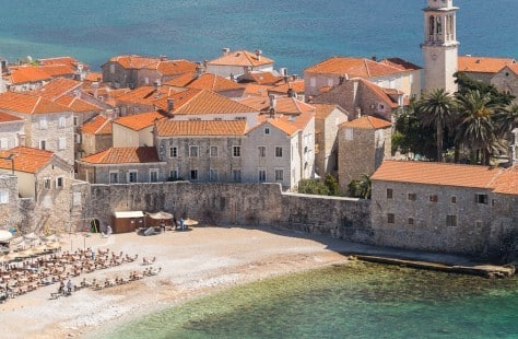 Dukley Marina is in Budva, a 3,500-year-old community with ancient stone walls and residences capped with orange terra cotta roofs.