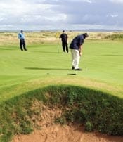 yachting/images/magazine/2007/012007/fea_scotland2_525x259.jpg Crater-like sand traps guard the well-manicured greens of the old course at Royal Troon Golf Club.