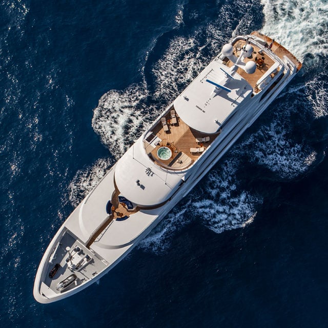 from_heli-936_square.jpg An excerpt from Grand Ambition: An Extraordinary Yacht, The People Who Built It, And The Millionaire Who Can't Really Afford It by G. Bruce Knecht, best-selling author of The Proving Ground. Evan Marshall, one of the world's most sought-after yacht designers, was in his London office in the fall of 2006, hunched over a door-sized desk that was covered with schematic drawings of Lady Linda. While his iPod shuffled through a collection of more than five thousand songs, a mix of soul, jazz, and rock from the 1960s to the present, he rarely lifted his head. When he did, it was only to look at his laptop, which held electronic versions of the same plans, together with engineering specifications.