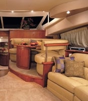Silverton 43 SportBridge INTERIOR MOTIVES: The glossy cherry of the galley and dinette gives a theatrical glow in night or day.