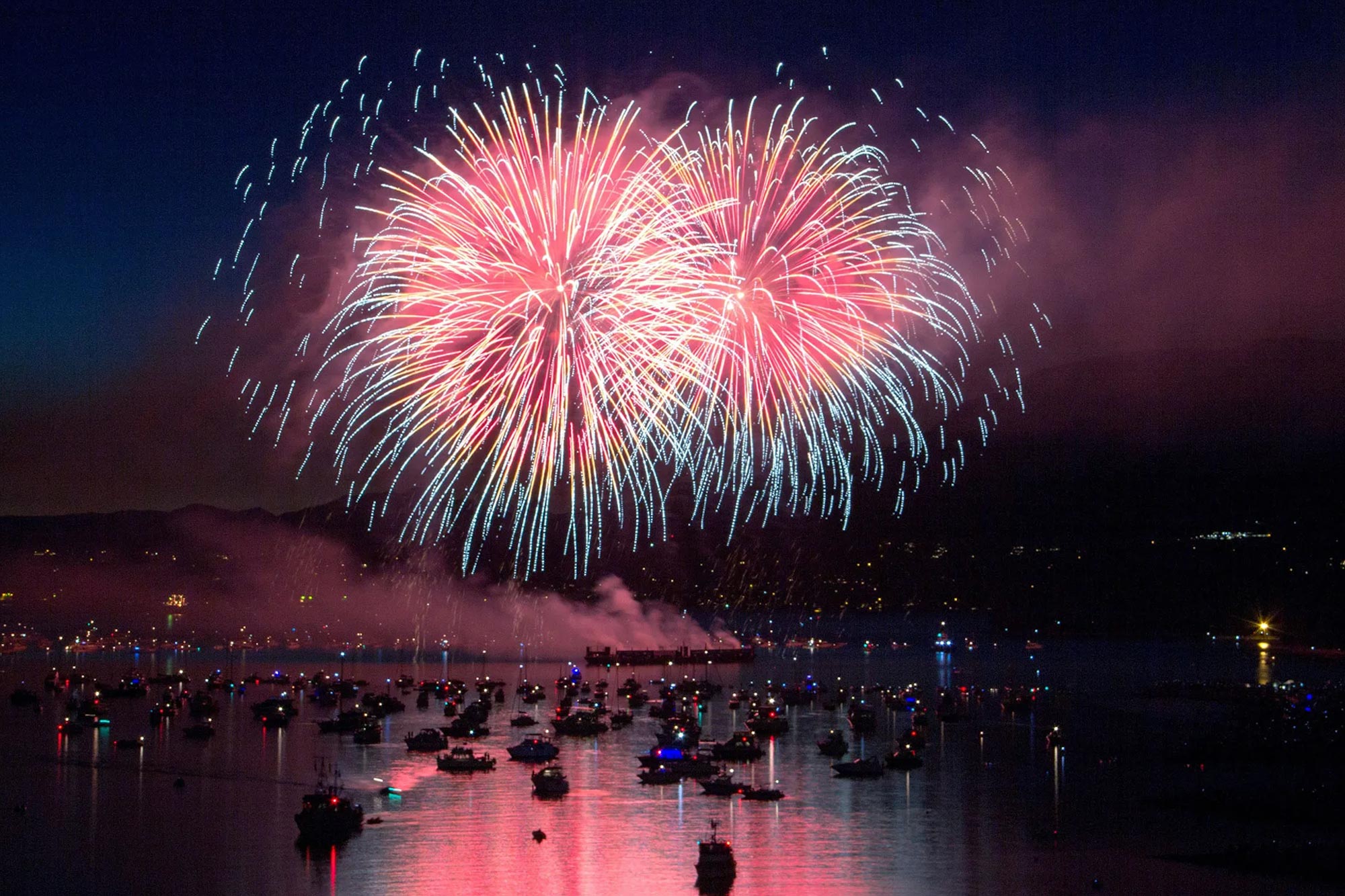 Boats gathered under fireworks