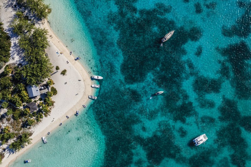 Aerial view of a white sandbar surrounded by turquoise water